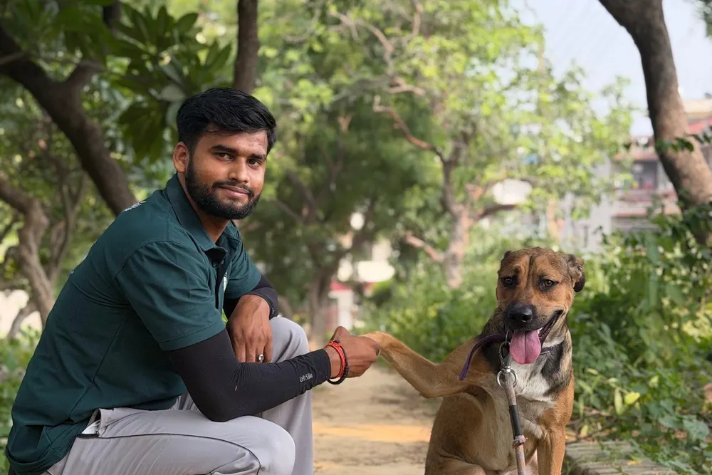 Trainer working on calm behaviour with an Indie dog
