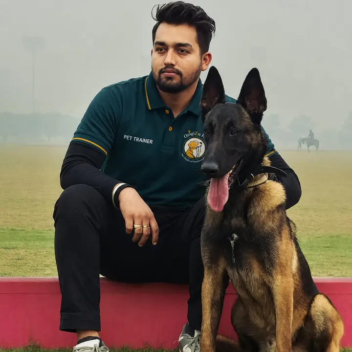 Raj Kaushik, OrigiZnPets dog trainer, with a Belgian Malinois